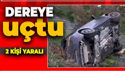 OTOMOBİL, DEREYE UÇTU: 2 YARALI